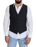 Gilet formel en laine noire Dolce & Gabbana avec taille stretch et fermeture à boutons, porté sur un mannequin.