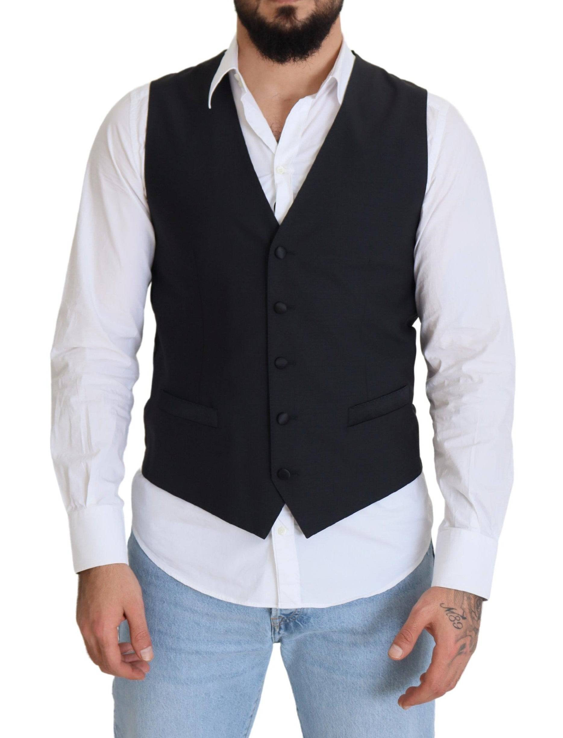 Gilet formel en laine noire Dolce & Gabbana avec taille stretch et fermeture à boutons, porté sur un mannequin.
