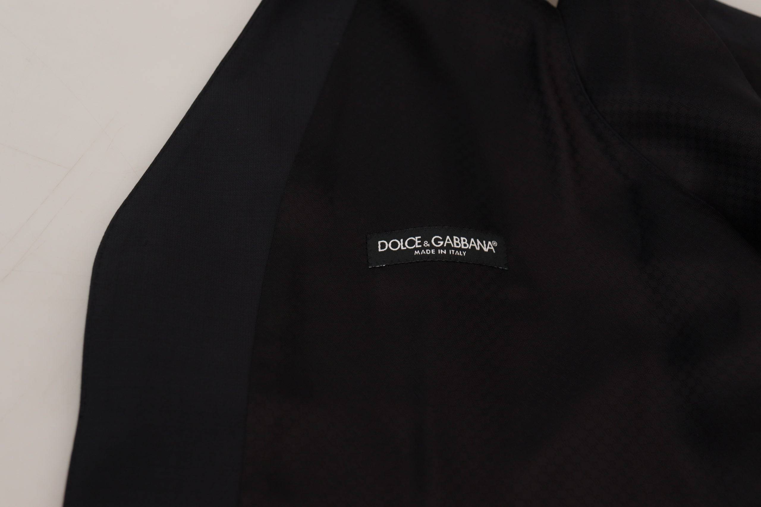 Gilet formel en laine noire stretch de Dolce & Gabbana, avec ceinture à la taille, pour un look élégant et raffiné.
