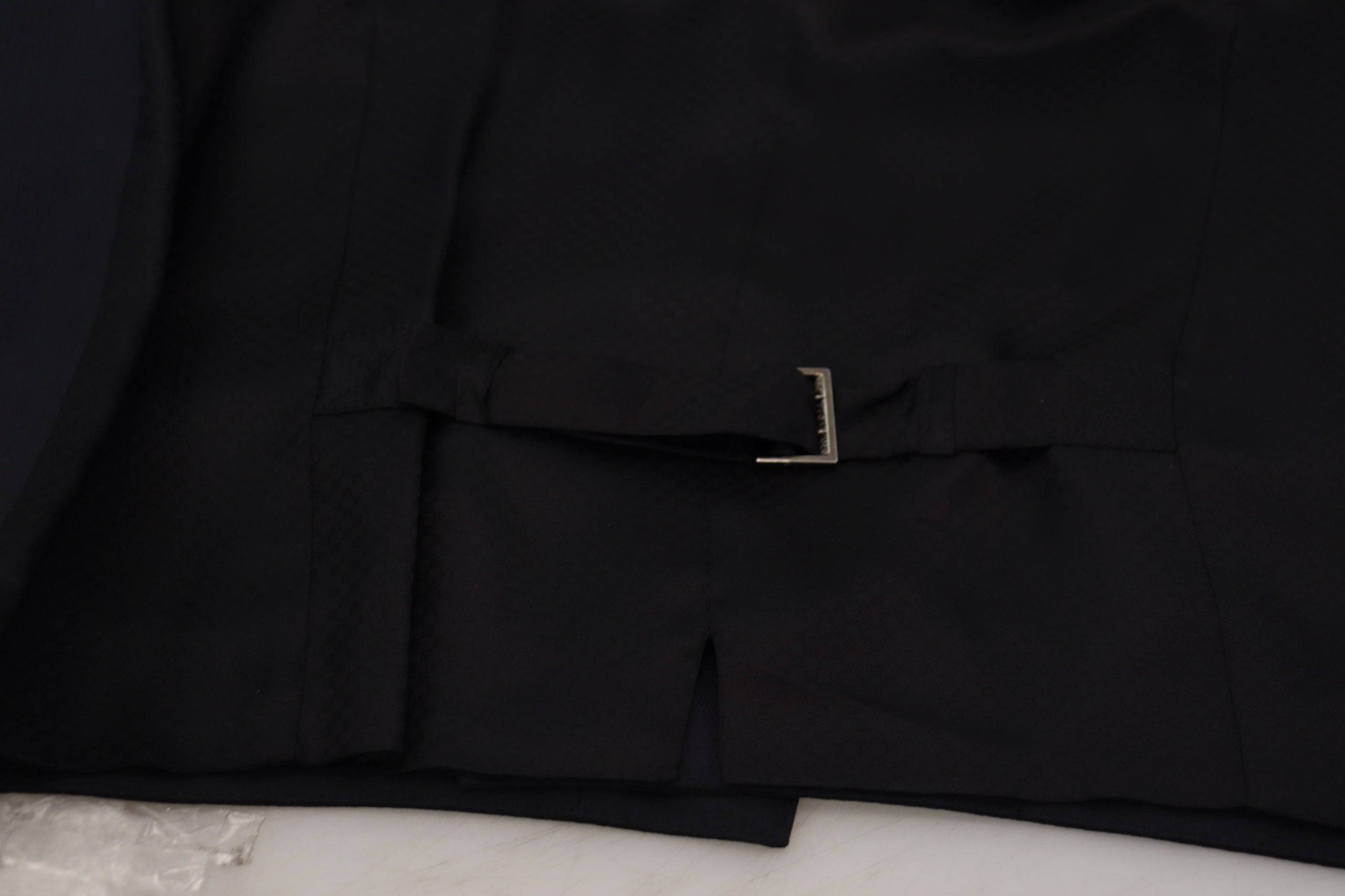 Gilet formel en laine stretch noir Dolce & Gabbana avec taille ajustée, idéal pour une tenue élégante et sophistiquée.
