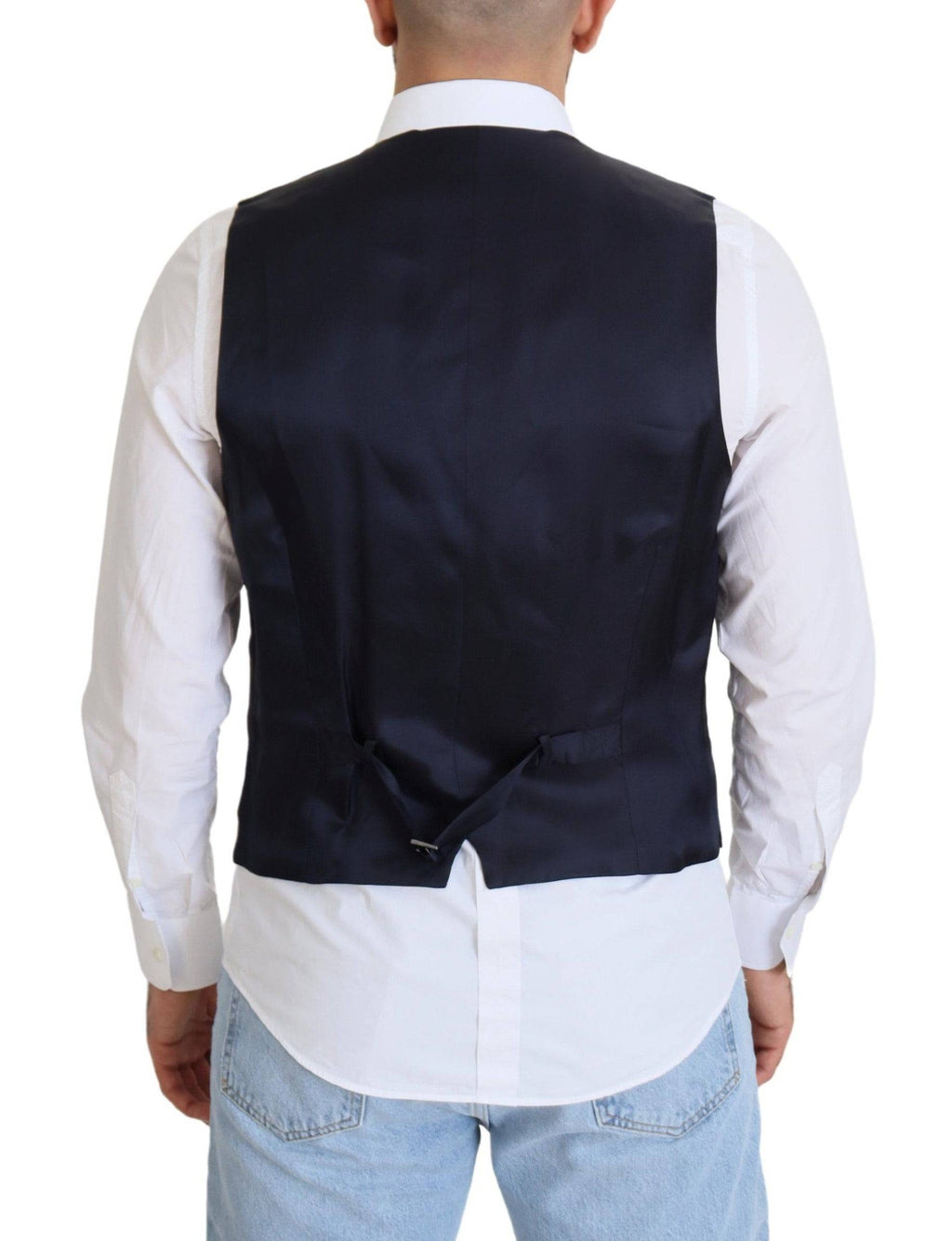 Gilet formel en laine stretch bleu foncé de Dolce & Gabbana, ajusté et élégant, porté sur un costume.