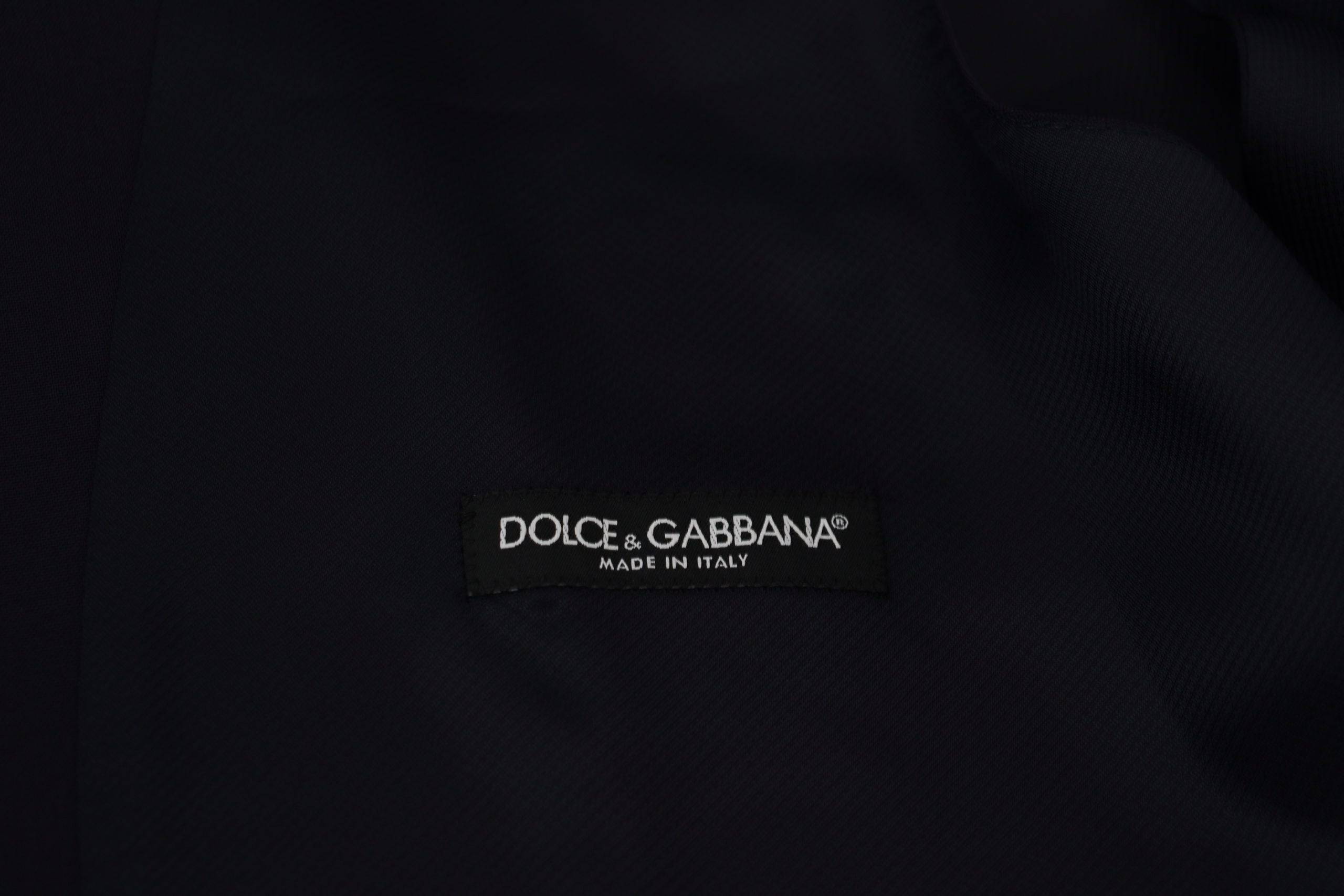 Gilet formel en laine bleu foncé de Dolce & Gabbana, coupe stretch, avec fermeture à boutons et col classique.