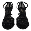 Sandales à talons aiguilles noires Dolce & Gabbana, chaussures élégantes en cuir avec bride à la cheville, vues de côté.