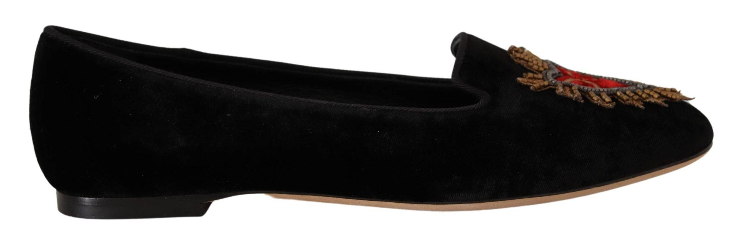 Chaussures plates Dolce & Gabbana en noir avec patch cœur sacré DG, slip-on élégantes et confortables, vues de face.
