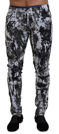 Jeans skinny en denim à motif tie-dye multicolore de Dolce & Gabbana, en coton, avec coupe ajustée et détails colorés.