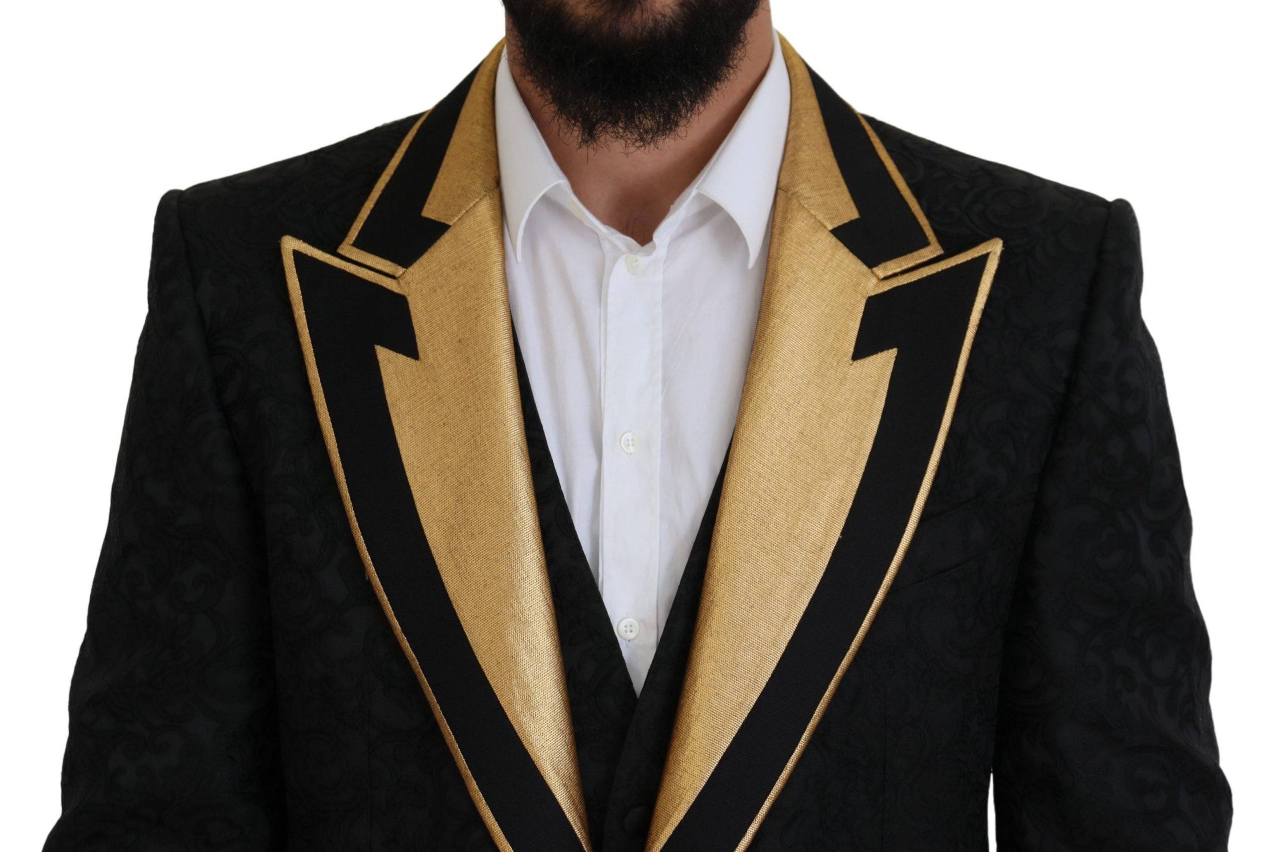 Costume slim fit noir et or Dolce & Gabbana avec détails fantaisie, tuxedo élégant pour homme.