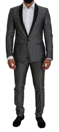 Costume slim fit en soie noir et blanc Dolce & Gabbana Martini, élégant et sophistiqué, visible avec détails de couture et finition fine.
