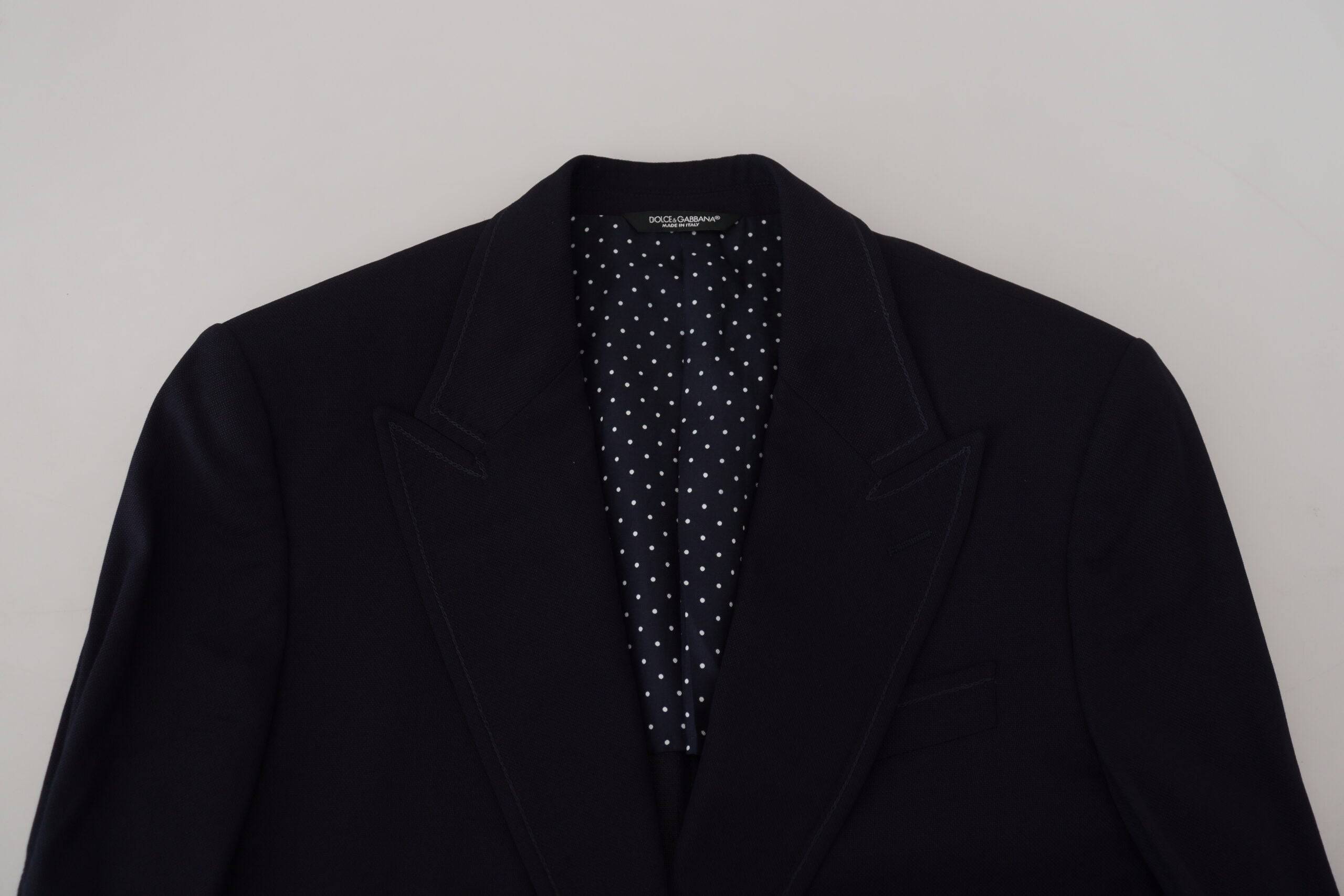 Veste formelle en laine bleue Dolce & Gabbana Taormina, élégante blazer pour homme, détail de couture visible.