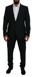 Costume noir Dolce & Gabbana à deux pièces avec veste croisée simple, style élégant et moderne pour homme.