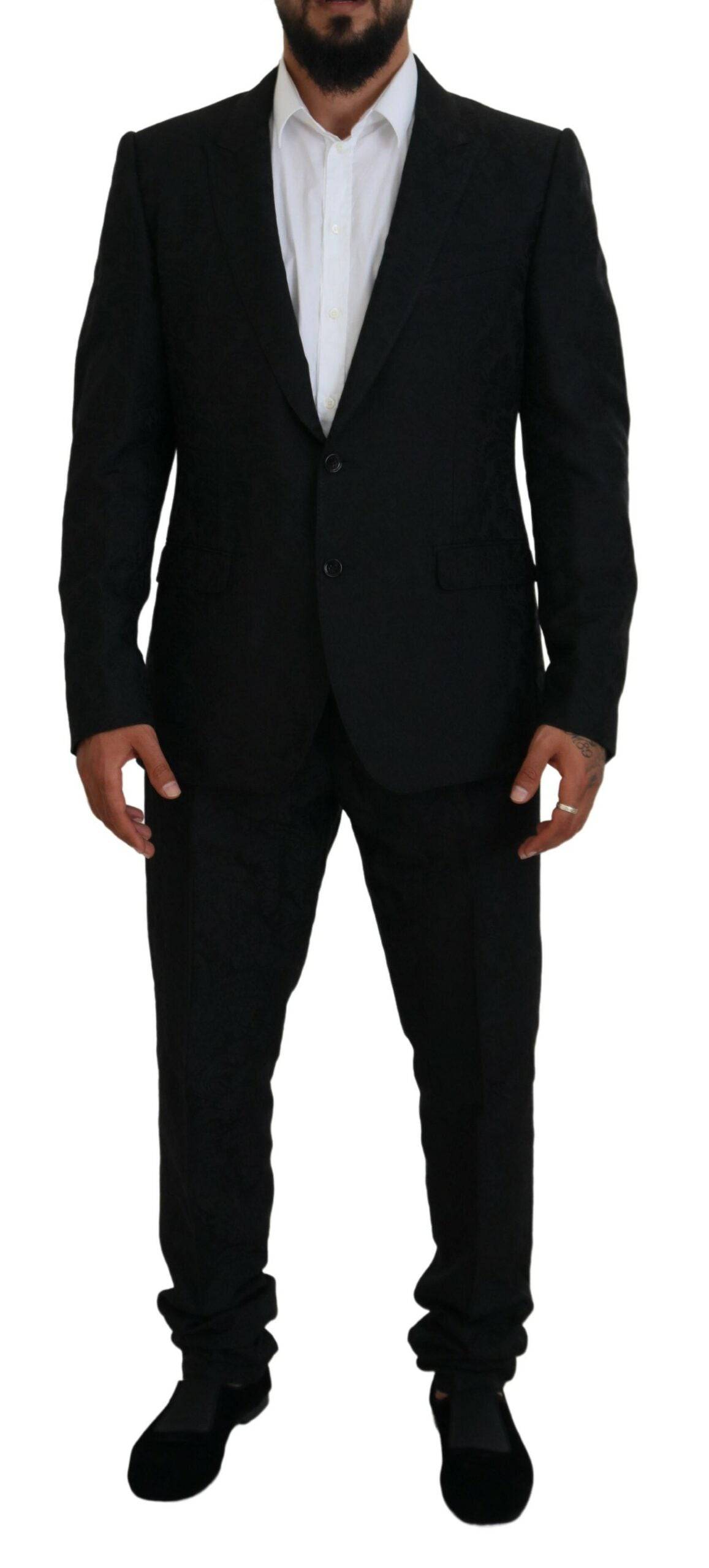 Costume noir Dolce & Gabbana à deux pièces avec veste croisée simple, style élégant et moderne pour homme.