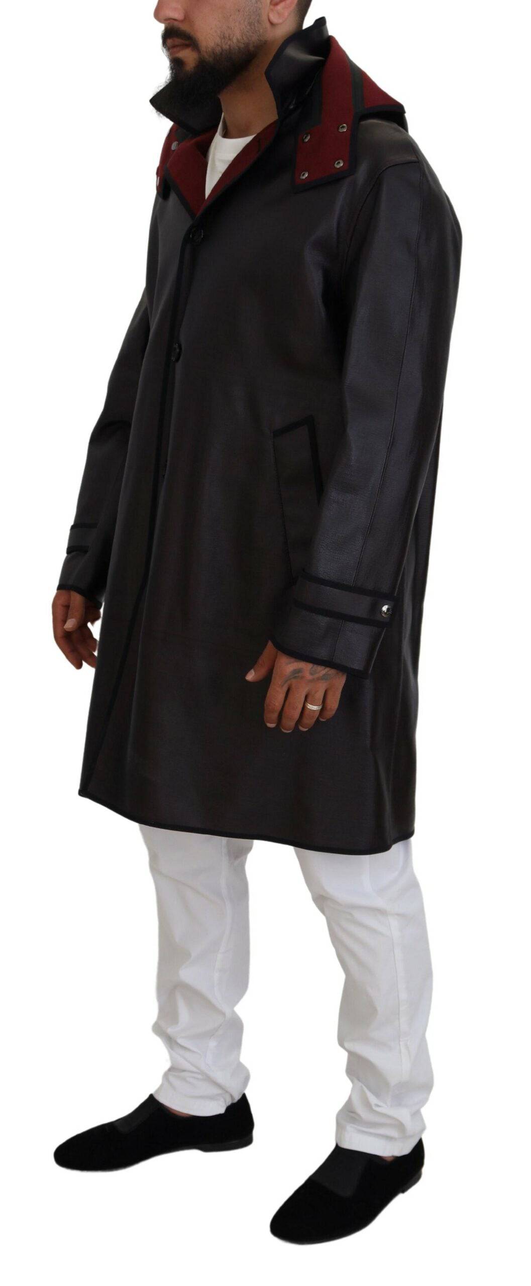 Imperméable noir Dolce & Gabbana avec capuche, coupe classique en coton, veste trench élégante et pratique.