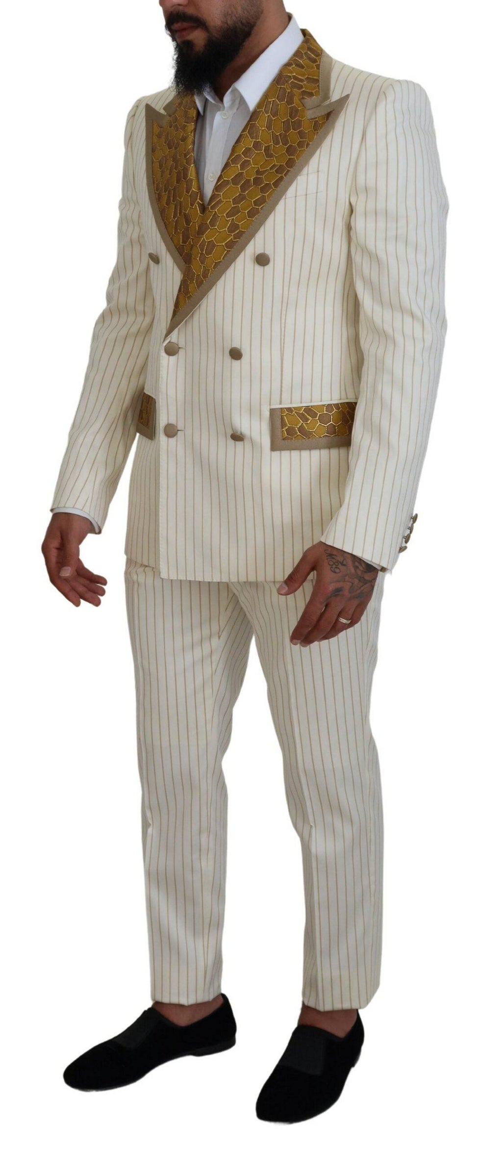 Costume blanc cassé à rayures dorées Dolce & Gabbana, costume slim fit élégant avec veste et pantalon assortis.
