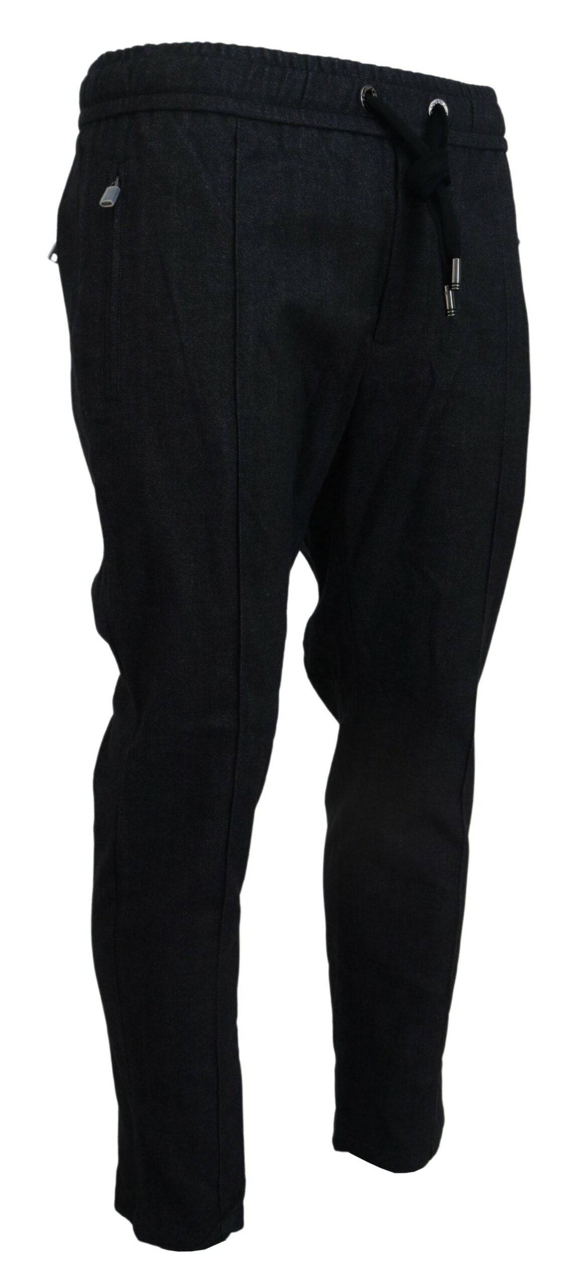 Pantalons en coton gris Dolce & Gabbana, coupe tapered, visibles en gros plan sur l'image.