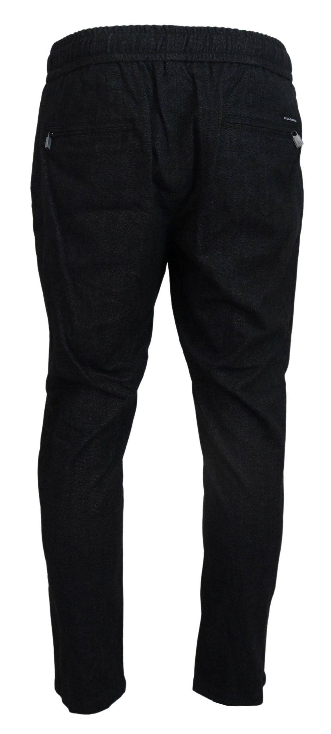 Pantalons gris en coton de coupe tapered de Dolce & Gabbana, style élégant et moderne, visibles en gros plan sur fond neutre.