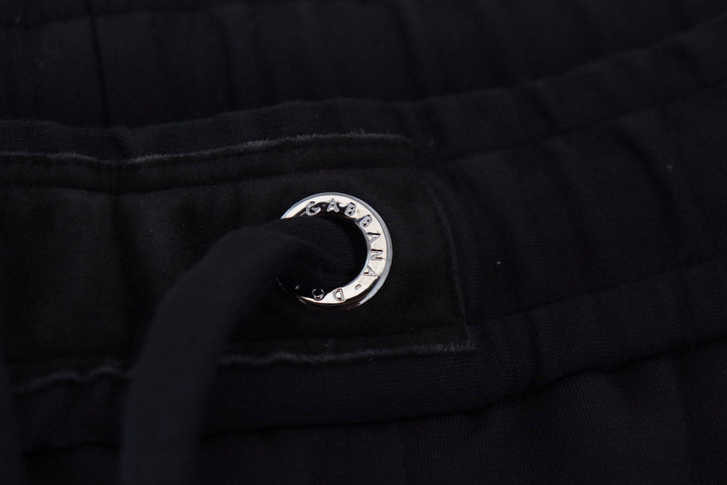 Pantalon de sport pour homme Dolce & Gabbana en laine noire, style décontracté, avec ceinture élastique et poches latérales.