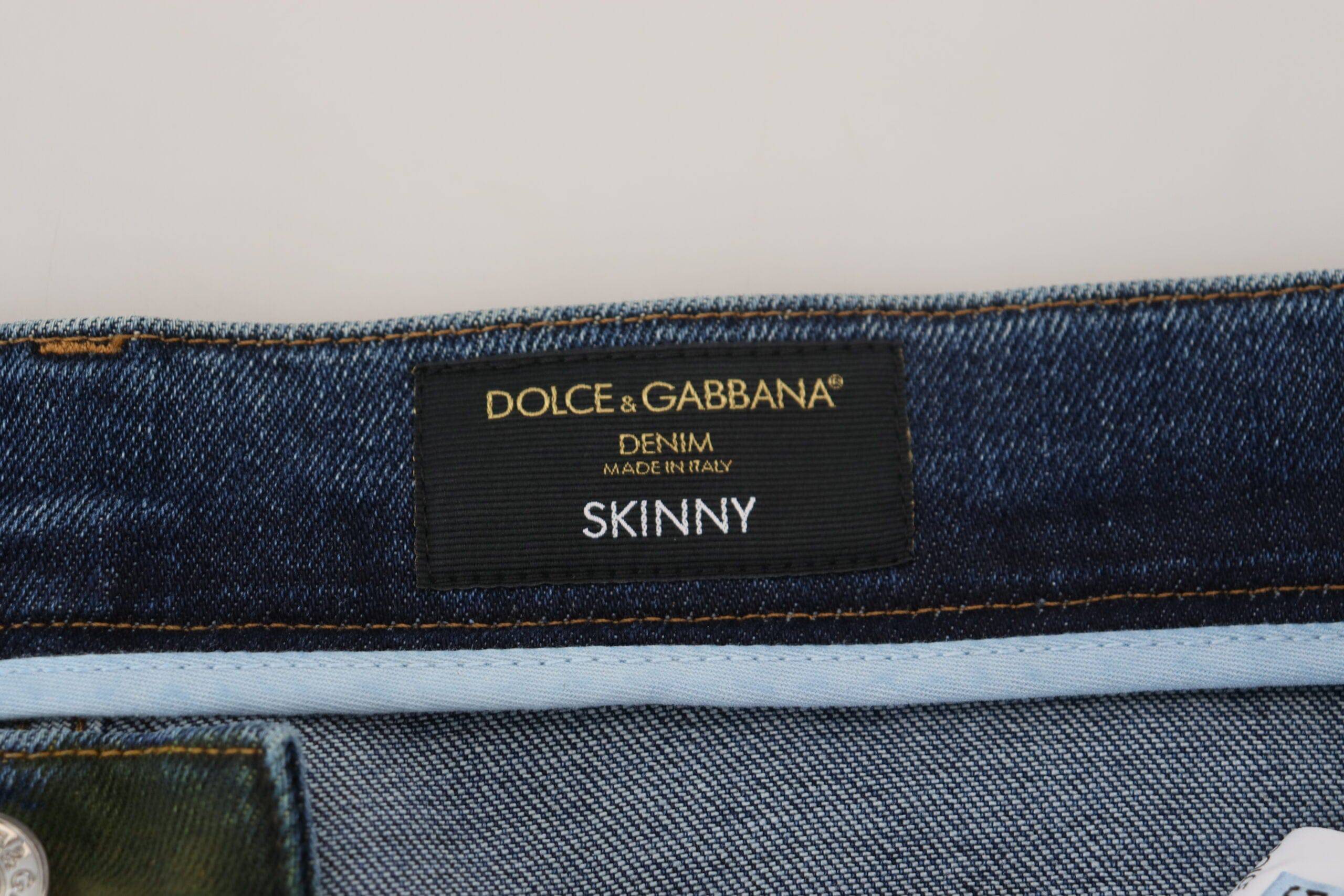 Jean skinny en coton denim bleu vert de Dolce & Gabbana, ajusté et tendance, visible en gros plan.