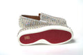 Chaussures plates Christian Louboutin, baskets bateau blanches et transparentes pour femme, style élégant et moderne.