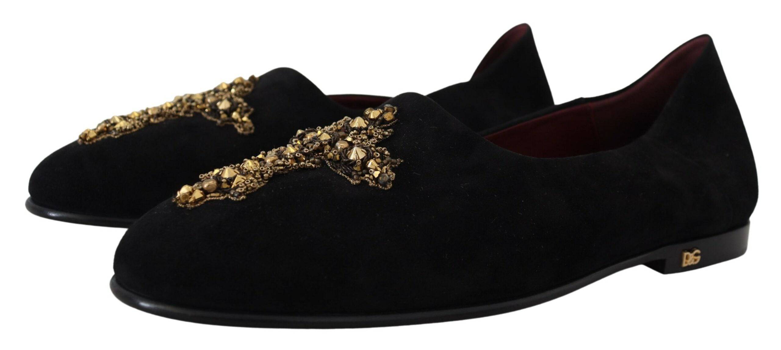 Chaussures mocassins Dolce & Gabbana en daim noir avec croix dorée, style slip-on élégant et sophistiqué.