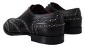 Chaussures Derby en cuir noir Dolce & Gabbana avec clous, élégantes et sophistiquées, vues de face sur un fond neutre.