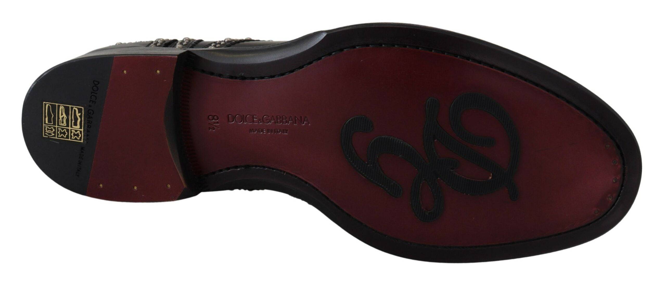 Chaussures derby en cuir noir Dolce & Gabbana avec détails cloutés et design élégant visible sur l'image.