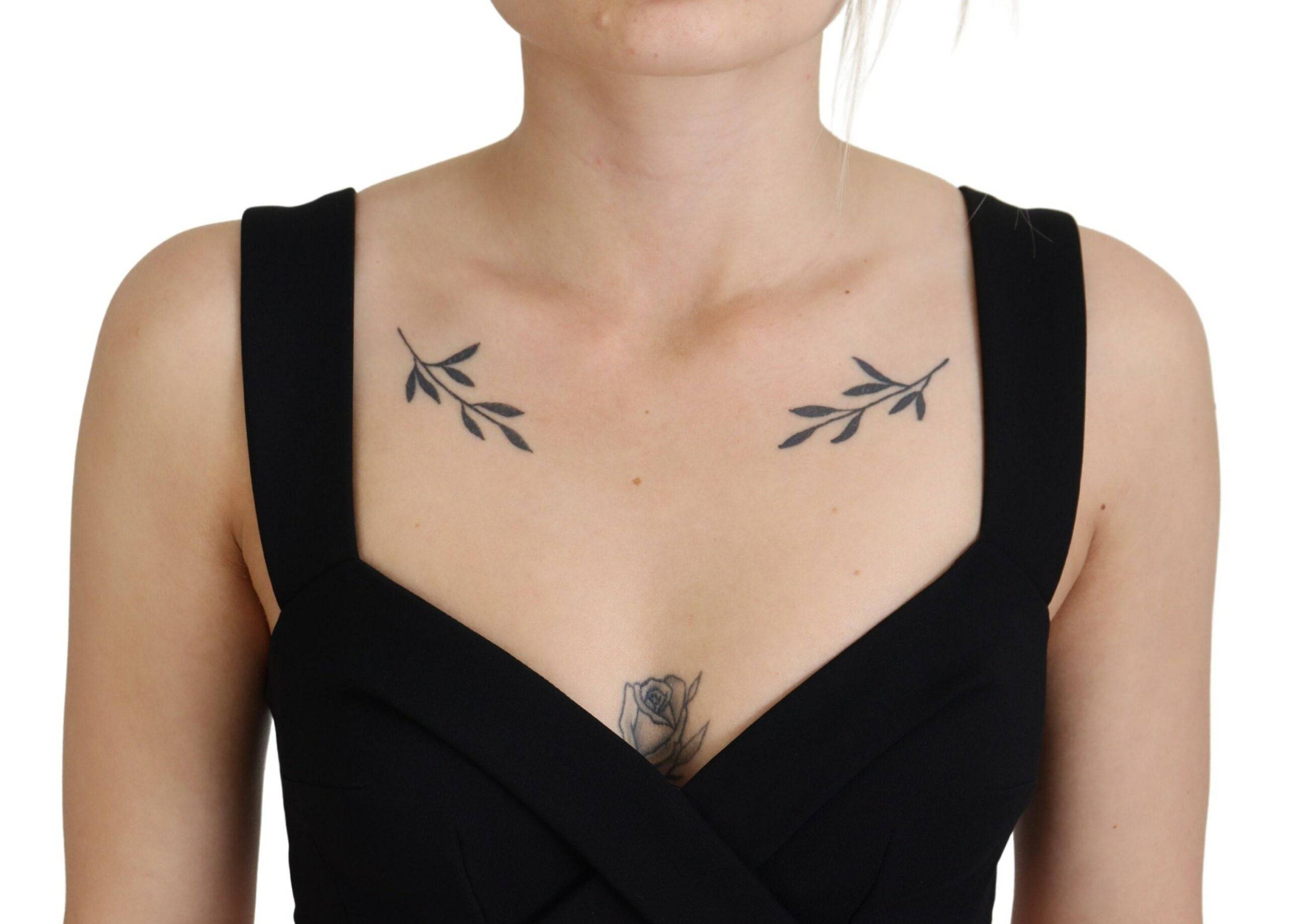 Robe noire moulante en viscose de Dolce & Gabbana, robe midi élégante avec coupe ajustée et style sophistiqué.