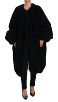 Manteau en cachemire noir Dolce & Gabbana avec fausse fourrure, coupe élégante et détails élégants.