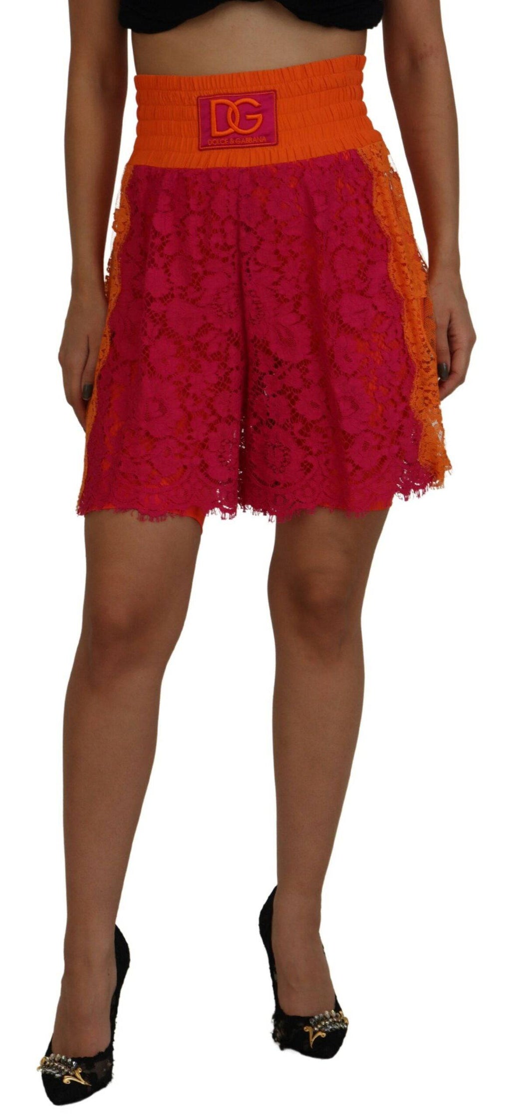 Shorts en coton rose orange à couture en dentelle Dolce & Gabbana, taille haute, détails élégants visibles sur l'image.