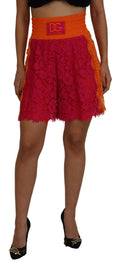 Shorts en coton rose orange à couture en dentelle Dolce & Gabbana, taille haute, détails élégants visibles sur l'image.