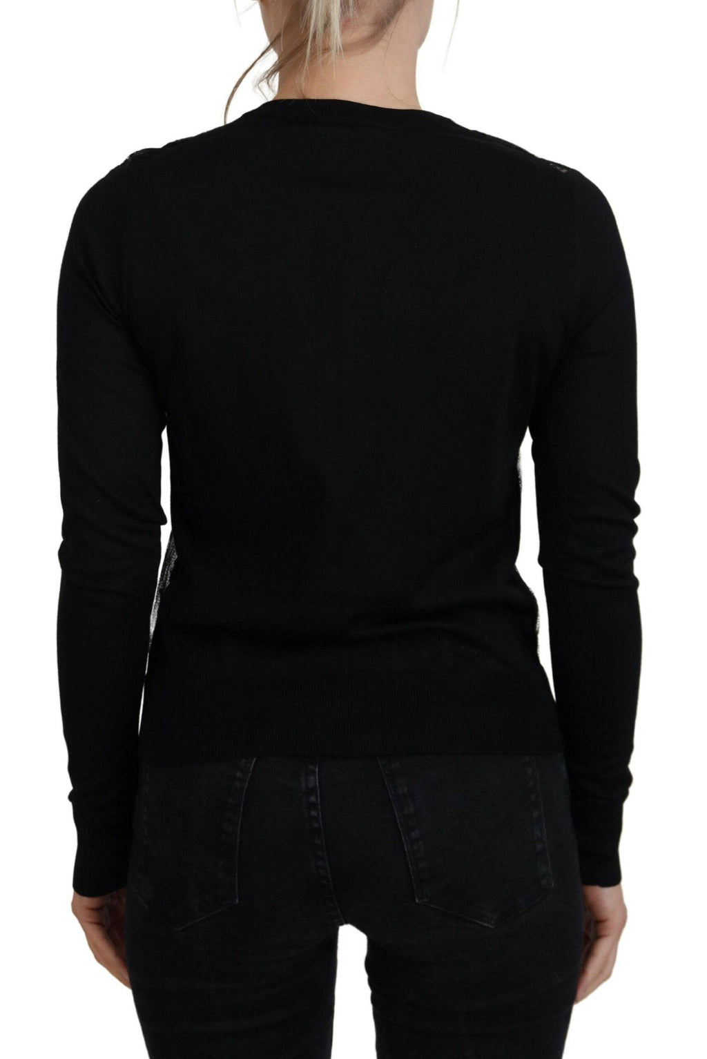 Cardigan en dentelle florale noire de Dolce & Gabbana avec boutons, élégant et féminin, porté sur un mannequin.