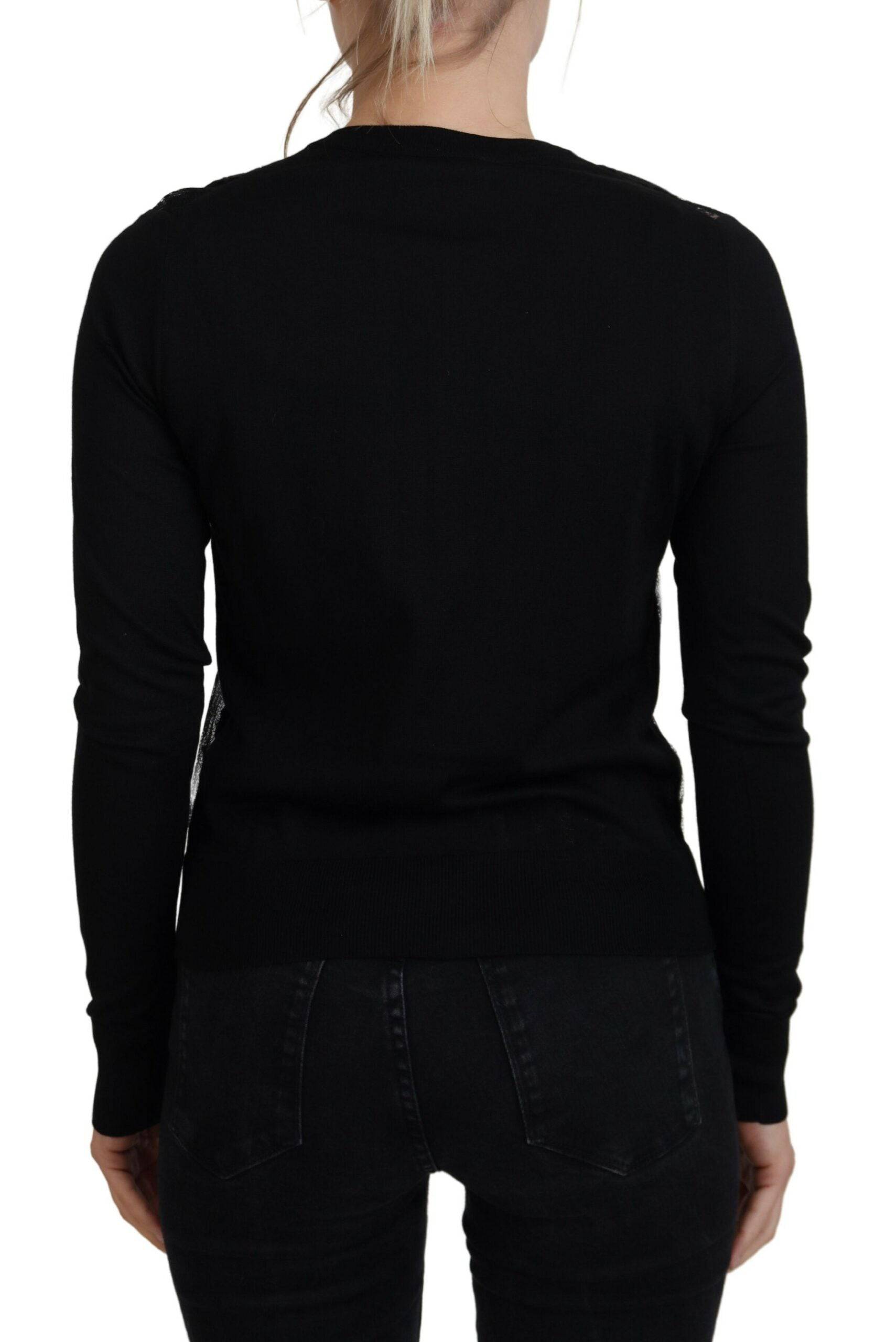 Cardigan en dentelle florale noire de Dolce & Gabbana avec boutons, élégant et féminin, porté sur un mannequin.