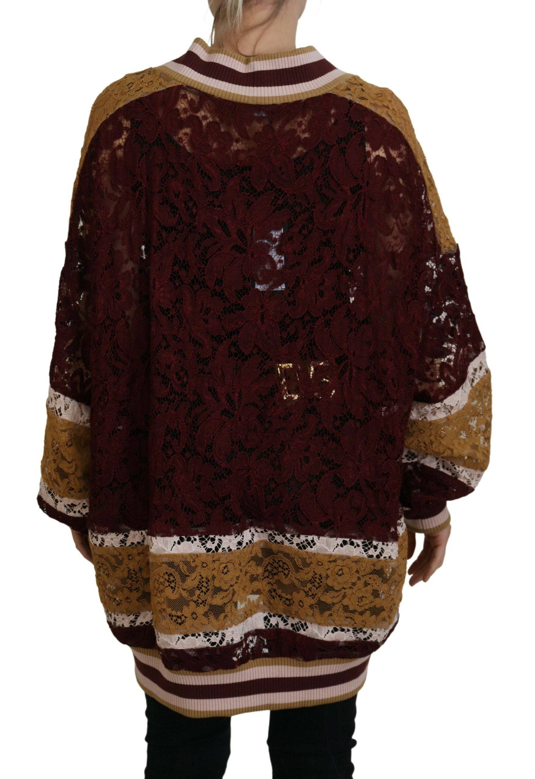 Pull en tricot Dolce & Gabbana en dentelle multicolore avec décolleté en V, tissu fin et détails élégants visible sur l'image.