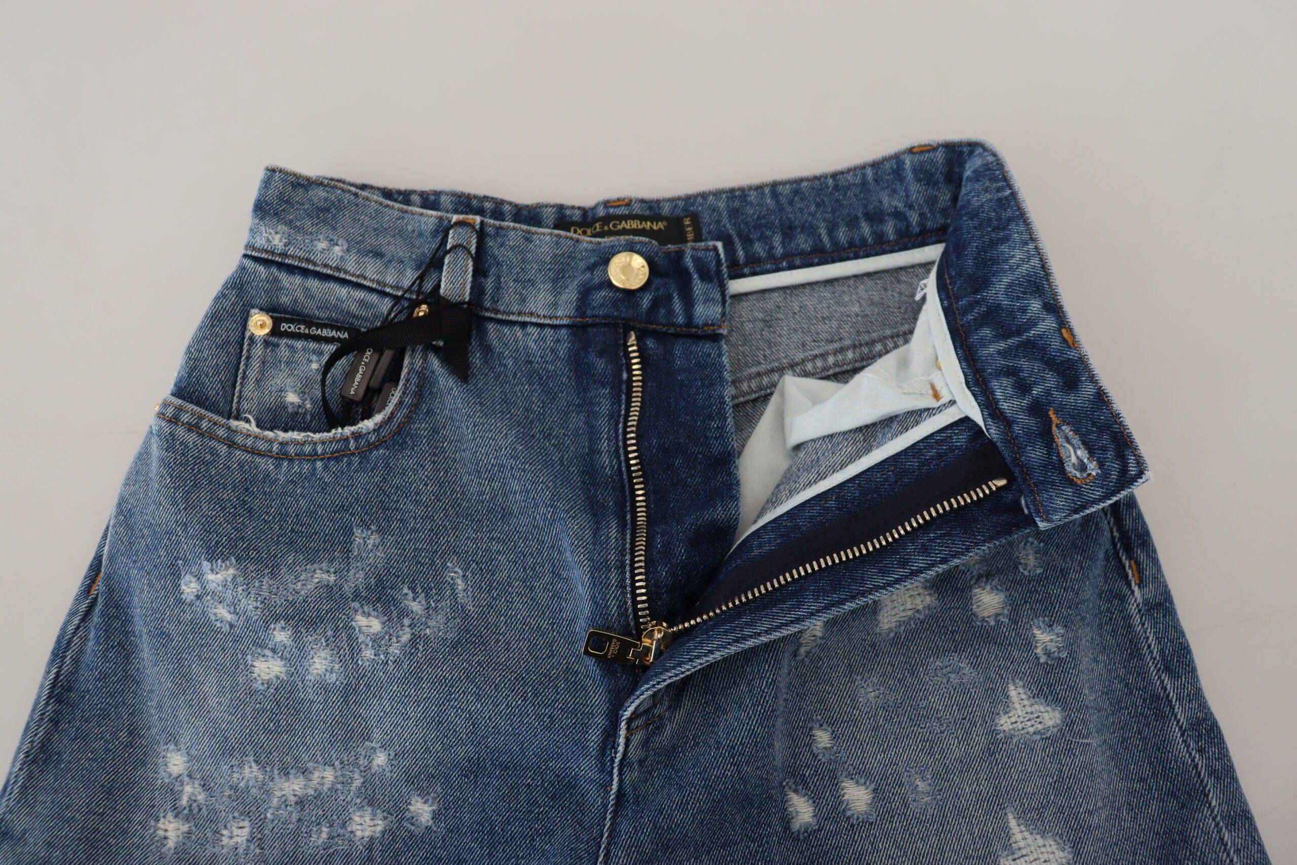 Jean skinny en denim bleu déchiré de Dolce & Gabbana, coupe moulante en coton, style décontracté et tendance.