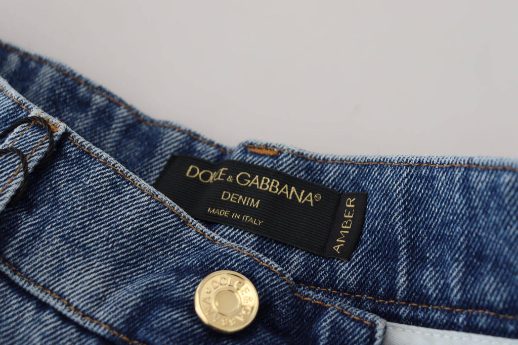 Jeans skinny en denim bleu déchiré Dolce & Gabbana, en coton, affichant un style tendance et moderne.
