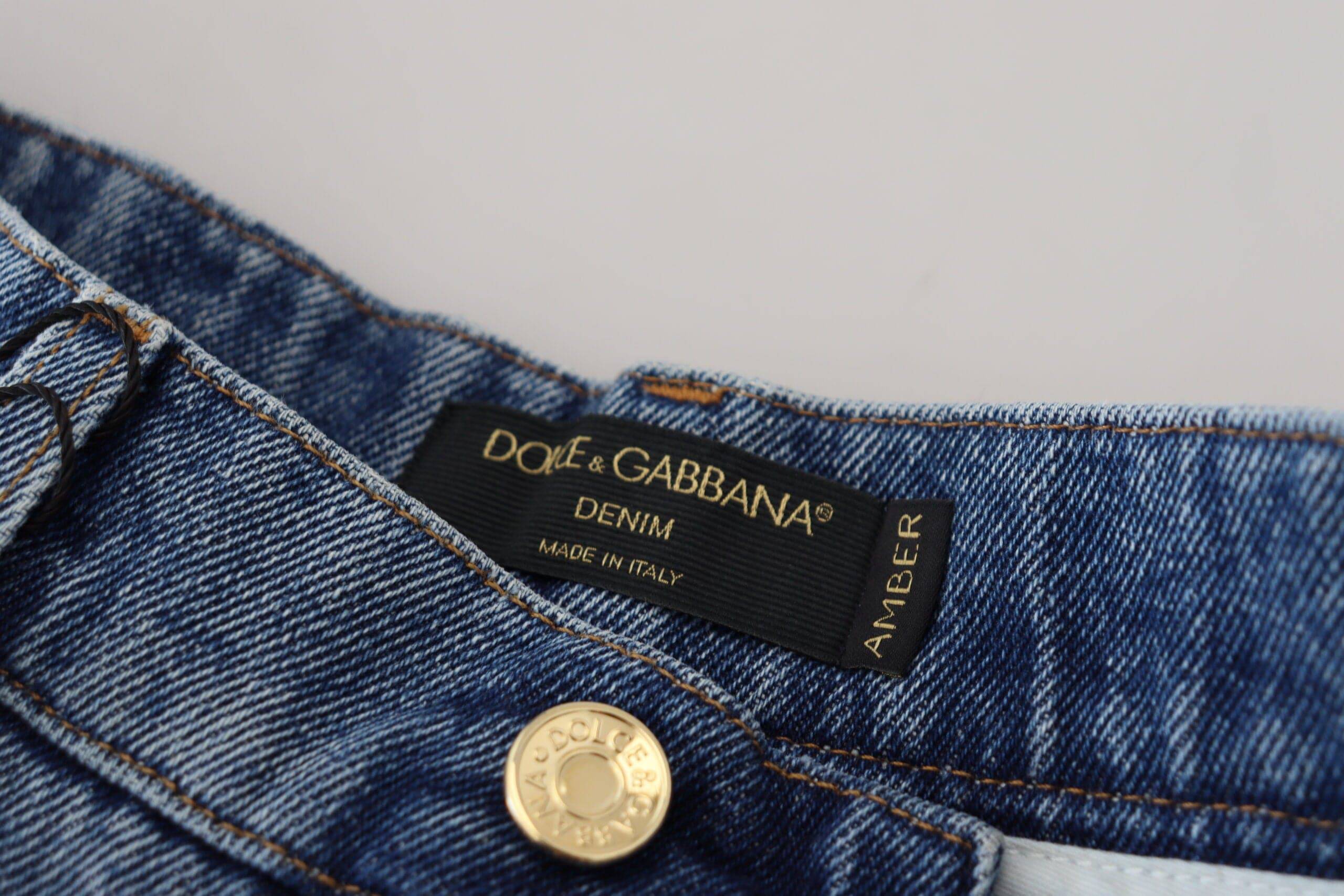 Jeans skinny en denim bleu déchiré Dolce & Gabbana, en coton, affichant un style tendance et moderne.