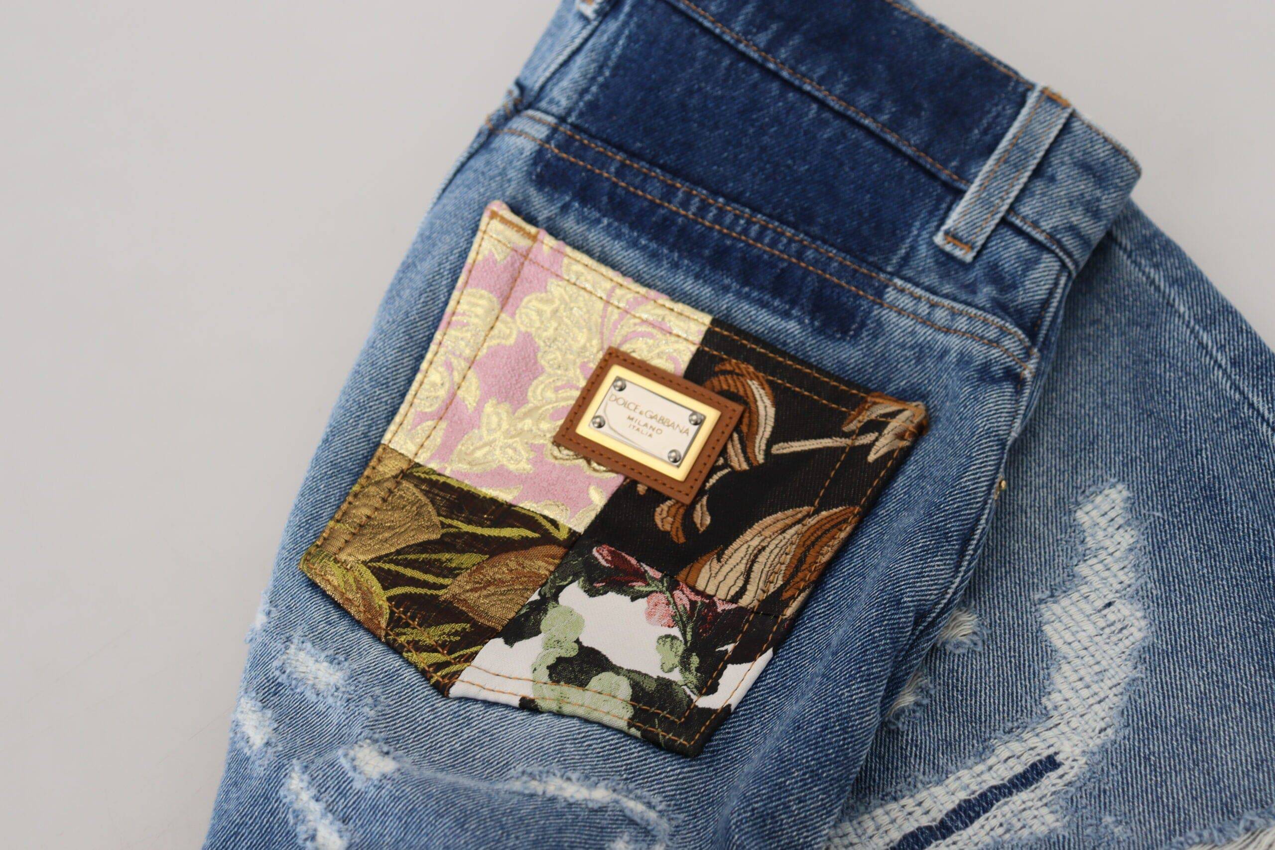 Jeans skinny déchirés en coton bleu Dolce & Gabbana, style décontracté avec détails usés et coupe ajustée.