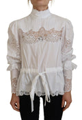 Blouse blanche en coton Dolce & Gabbana avec col roulé et bordure en dentelle, élégante et féminine.