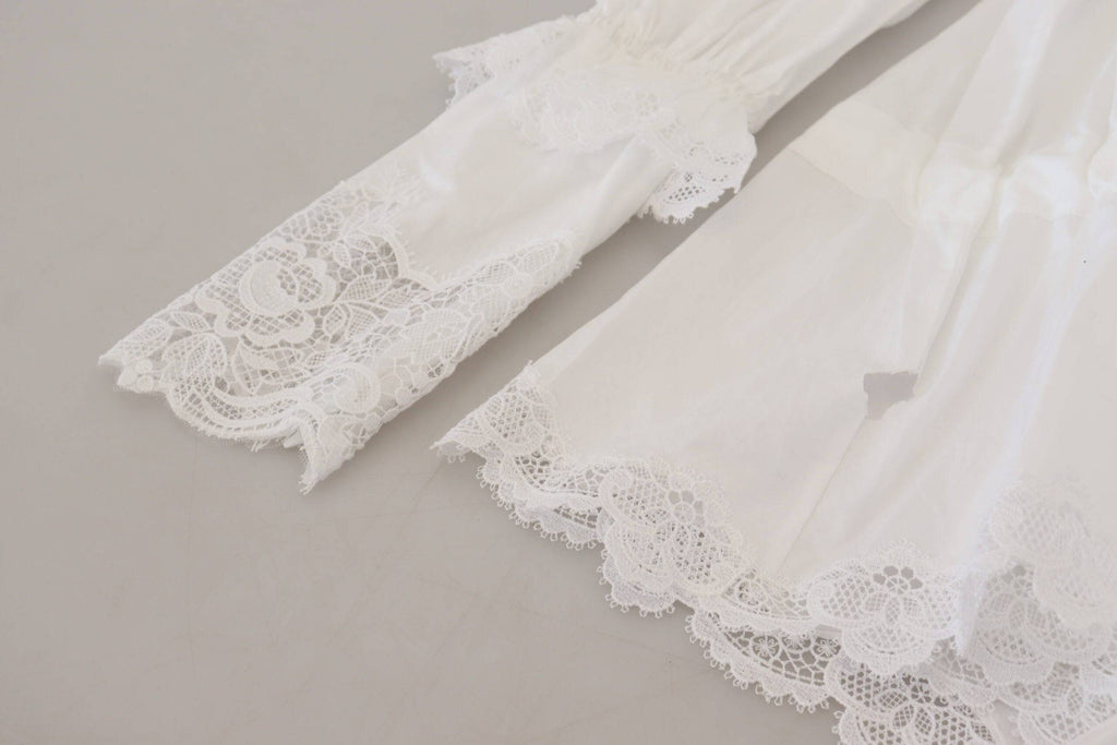Blouse Dolce & Gabbana en coton blanc avec col montant et finition en dentelle, détails élégants et tissu léger.