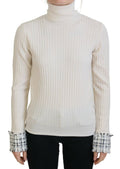 Pull en laine ivoire Dolce & Gabbana à col roulé, manches distressed et poignets déchirés, style chic et décontracté.