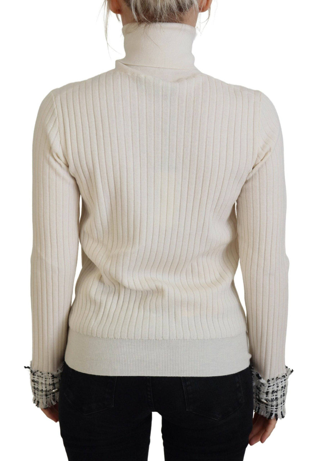 Pull en cachemire ivoire Dolce & Gabbana avec col roulé et poignets déchirés, style élégant et décontracté.