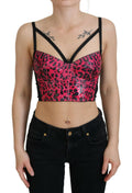 Corset crop top Dolce & Gabbana à imprimé léopard rose, ajusté et élégant, en tissu léger avec détails sophistiqués.