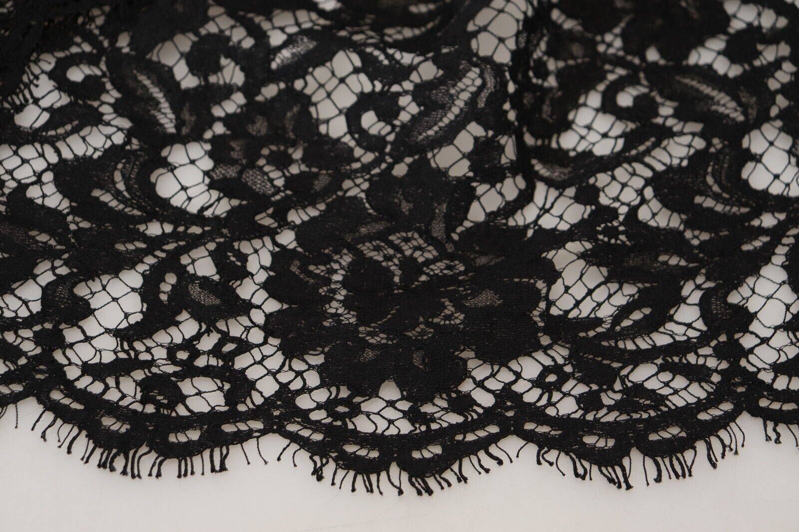 Robe courte Dolce & Gabbana en coton noir avec dentelle florale, silhouette fluide et élégante.