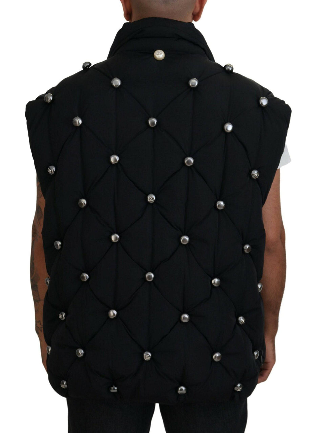 Veste sans manches noire Dolce & Gabbana avec embellissements en métal, style élégant et moderne.
