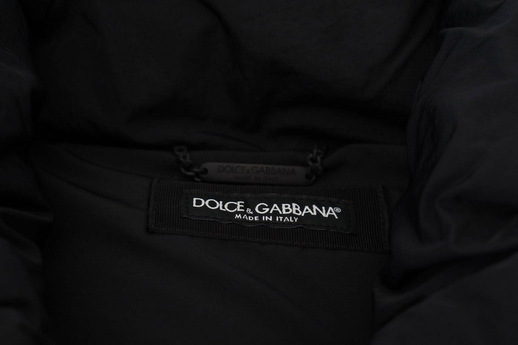 Veste sans manches noire Dolce & Gabbana avec embellissements en métal et détails élégants, vue de face.