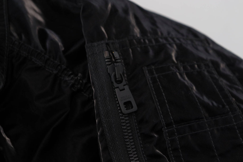 Veste bomber noire en nylon avec capuche et fermeture éclair complète de la marque Dolce & Gabbana.