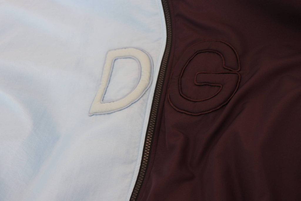 Veste homme Dolce & Gabbana noire et bleue à capuche avec fermeture éclair intégrale, style décontracté et moderne.