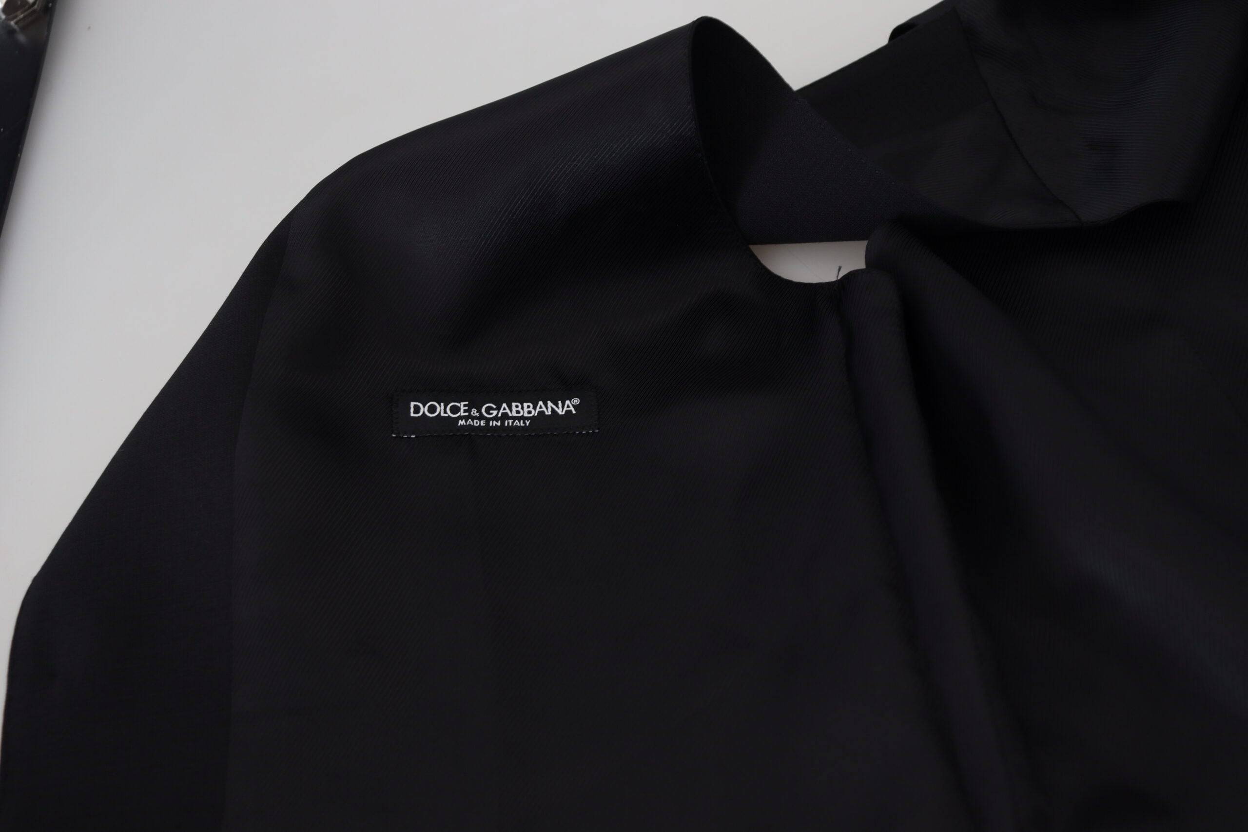 Gilet formel en laine vierge noire Dolce & Gabbana avec col en V et fermeture à boutons, élégant et sophistiqué.