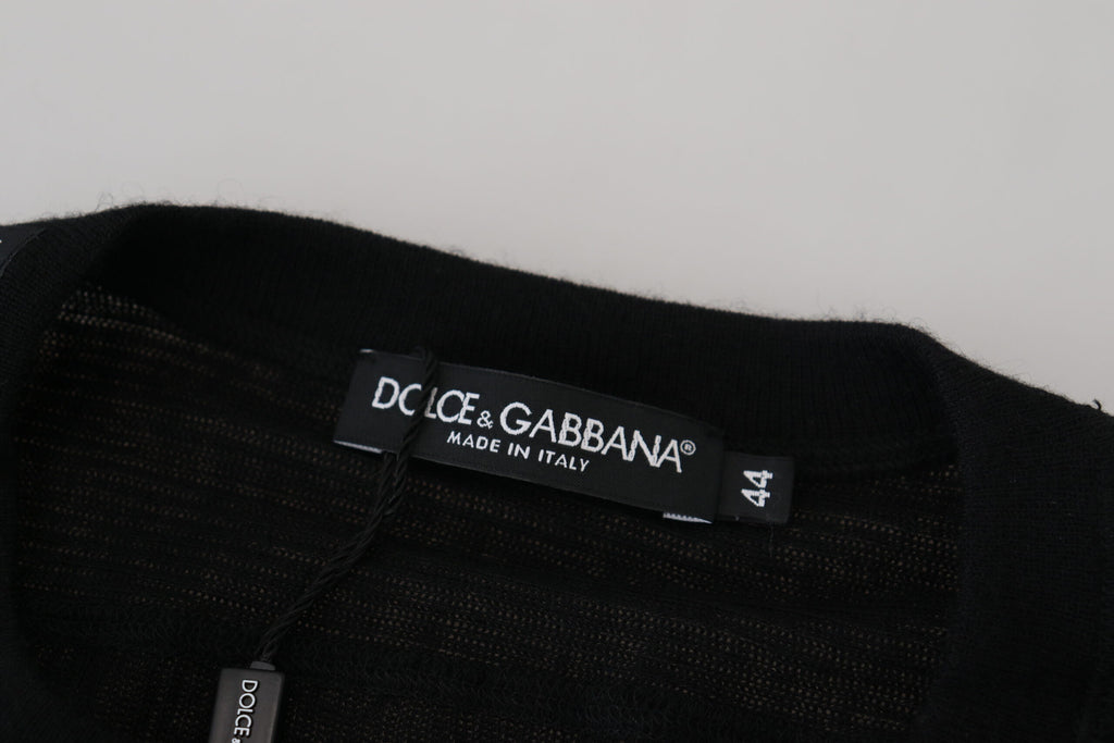 Pull en cachemire noir Dolce & Gabbana avec boutons, vue de face montrant le détail du tissu doux et élégant.