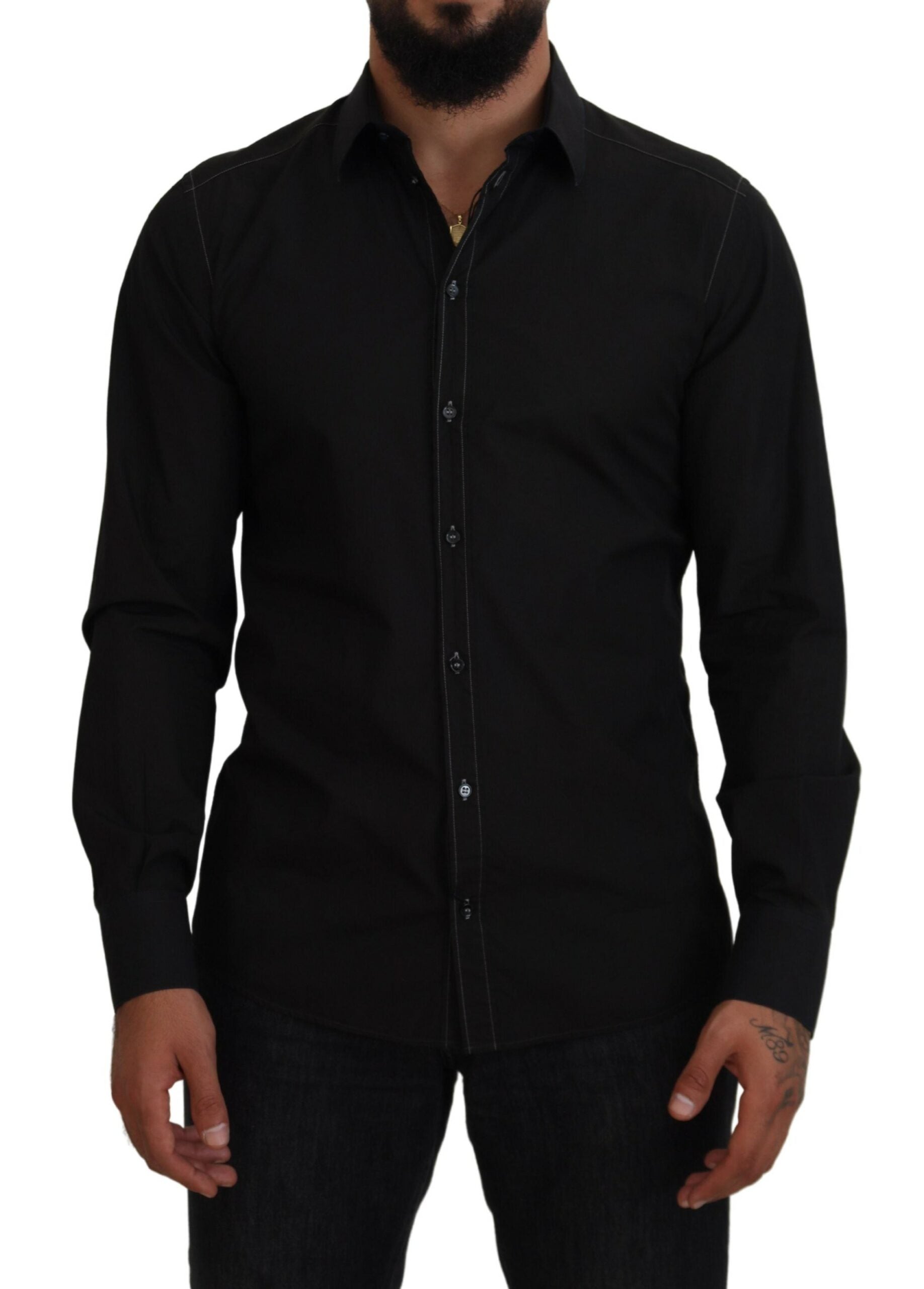 Chemise noire Dolce & Gabbana en coton avec col, manches longues et détails dorés visibles sur l'image.
