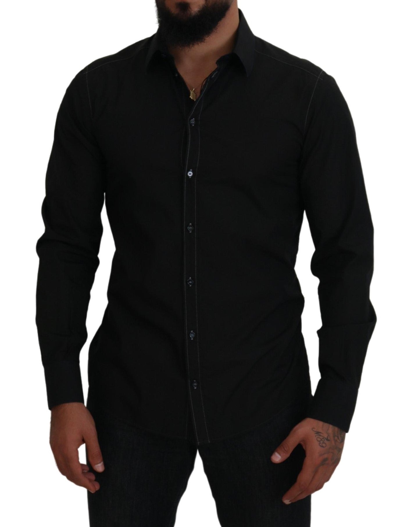 Chemise longue noire Dolce & Gabbana en coton avec col et manches longues, détails dorés visibles sur l'image.