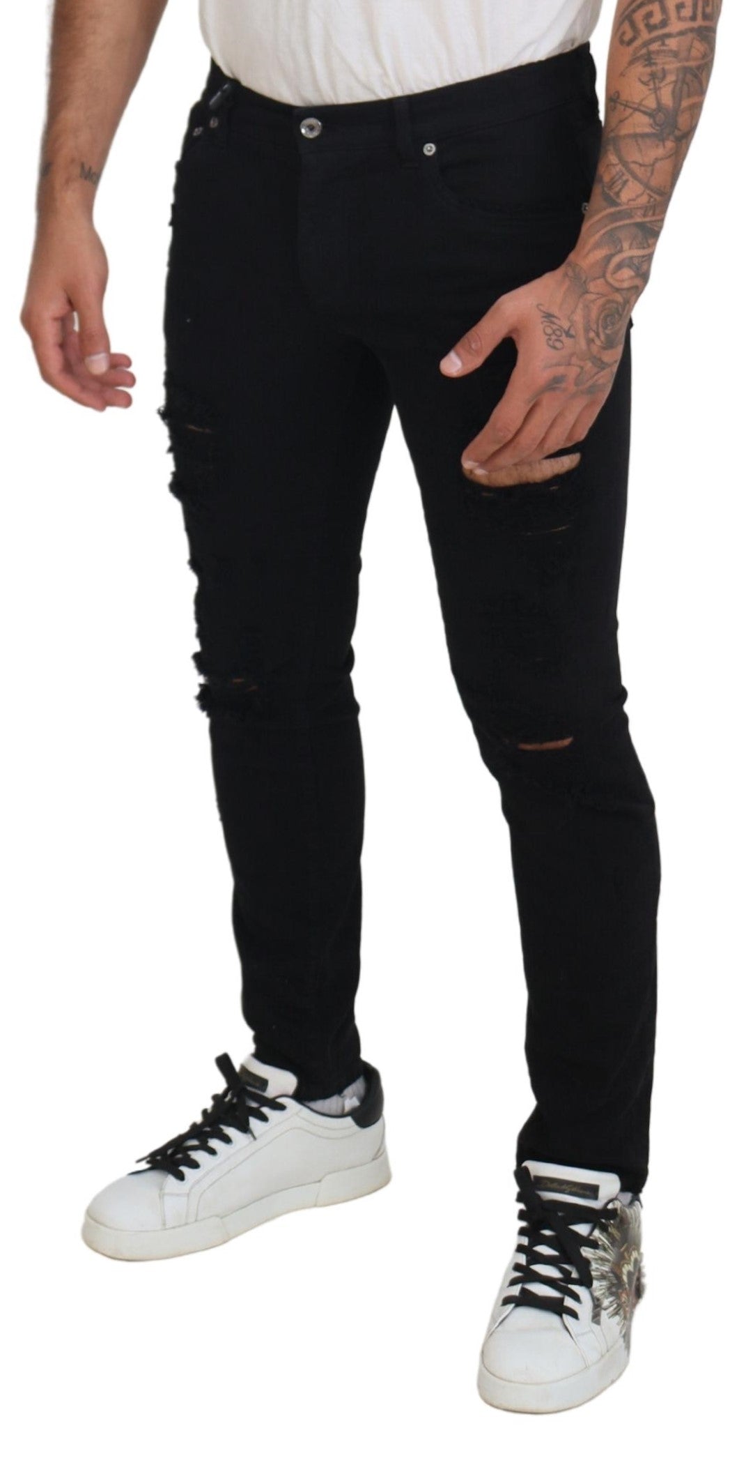 Jean en denim noir Dolce & Gabbana, coupe slim, effet déchiré, coton, mode masculine élégante, visible en détail.